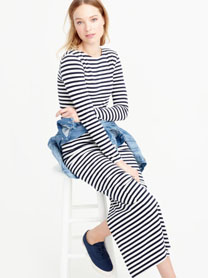With a long maxi dress and denim jacket.